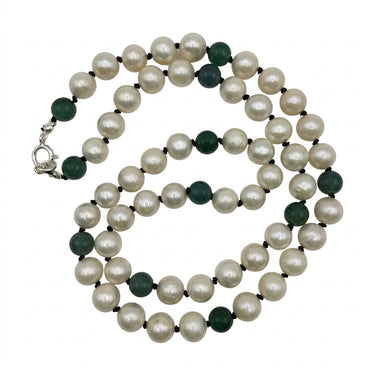 Pearl necklace with alternating dark green beads and small black spacer beads, featuring a silver clasp, displayed on a clean white background.