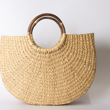 Sea grass bag with cane handle