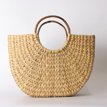 Sea grass bag with cane handle