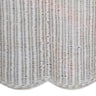 Wicker ottoman with a white cushion on a white background