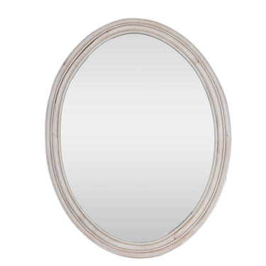 Round mirror with a beige frame on a white background