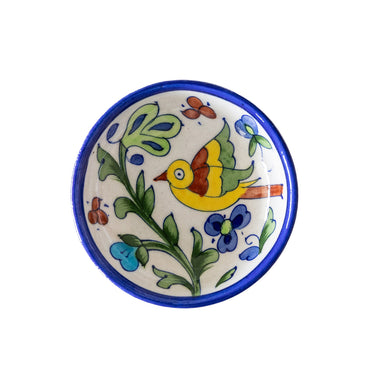 Ceramic plate with colorful bird and floral design