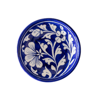 Blue ceramic bowl with white floral patterns