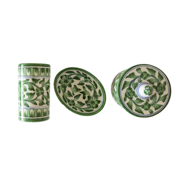 Set of three ceramic bathroom accessories with green floral patterns 