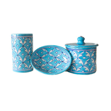 Set of three blue ceramic bathroom accessoris with turquoise and white geometric patterns 
