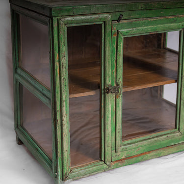 Glass-fronted 3 panel green wooden cabinet