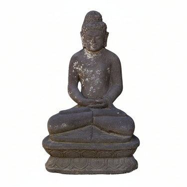 A dark gray stone Buddha statue in a seated meditation pose