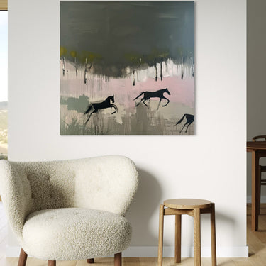 An abstract canvas painting featuring black horses silhouetted against a background of dark gray, soft pink, and light green brushstrokes