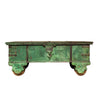 Vintage green wooden trunk with metal handles on a white background
