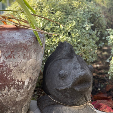Decorative stone fish sculpture