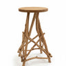 A rustic wooden occasional table with a round light wood tabletop and four natural driftwood legs
