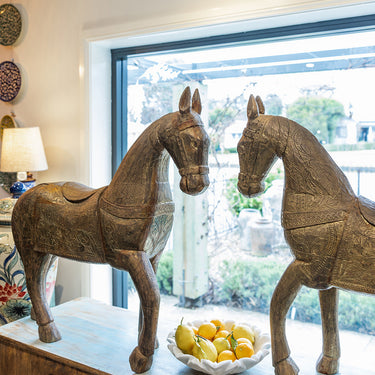 Two decorative horse statues 