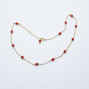 Gold necklace with red coral beads 