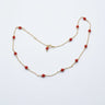 Gold necklace with red coral beads 