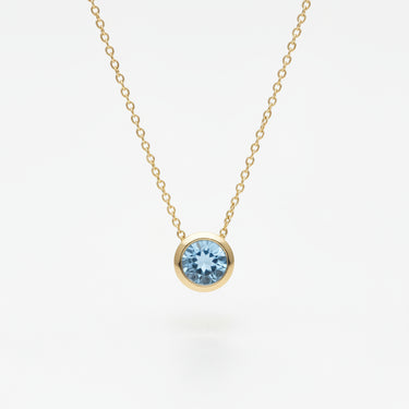 Gold Necklace with a blue topaz gemstone pendant 