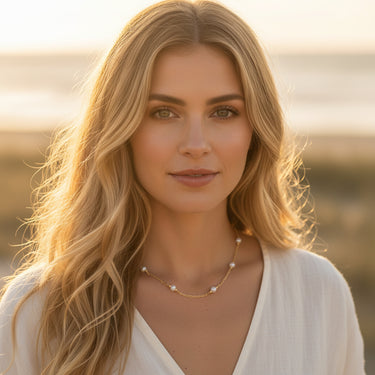 Gold necklace with white pearls 