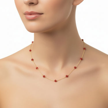 Necklace with red coral and gold chain next t
