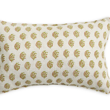 Decorative pillow with gold leaf pattern on a white background