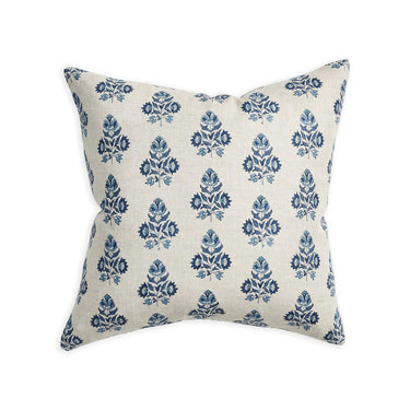 Decorative pillow with blue floral pattern on a white background