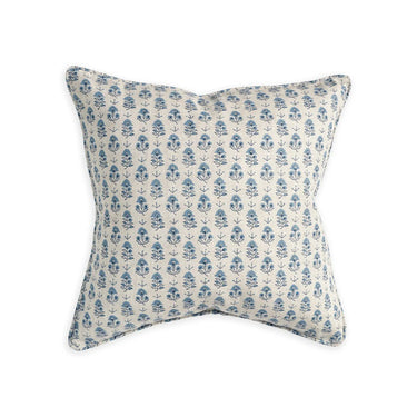 Decorative pillow with blue floral pattern on a white background