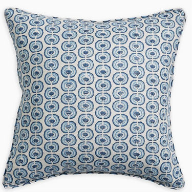 Decorative pillow with blue circular pattern on a white background