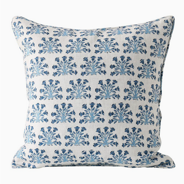 Decorative pillow with blue floral pattern on a white background