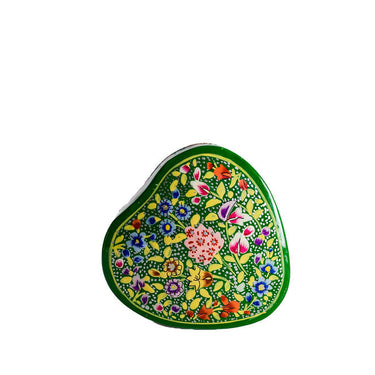 Decorative heart-shaped object with floral patterns