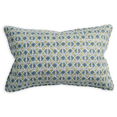 Decorative pillow with blue and yellow geometric pattern on a white background
