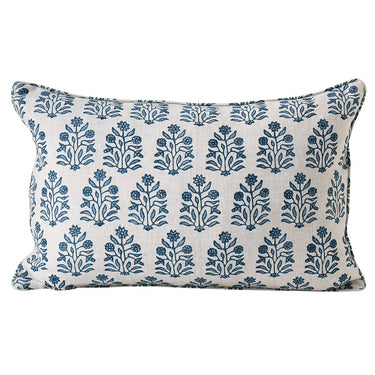 Decorative pillow with blue floral pattern on a white background