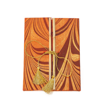 recycled-cotton paper journal with gold tassel ties