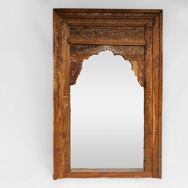 carved wooden window mirror